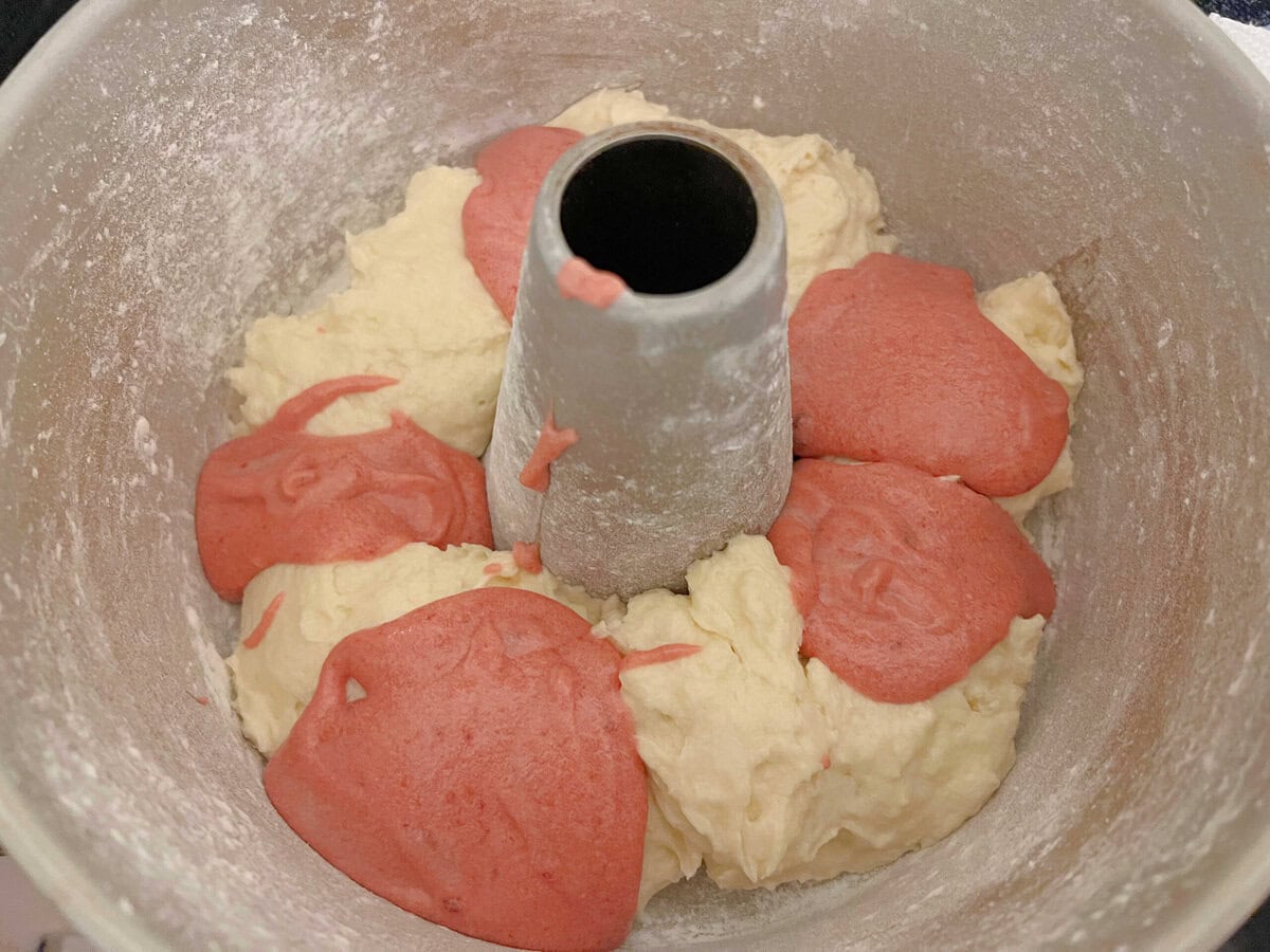 Layering the coconut and raspberry batter.