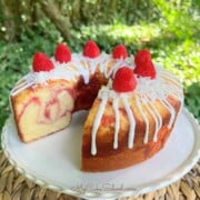 Raspberry Coconut Pound Cake on a pedestal.