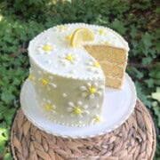 White Chocolate Lemon Cake on a pedestal.