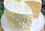 White Chocolate Lemon Cake on a pedestal.