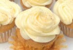 Moist Pumpkin Cupcakes on a cake platter.