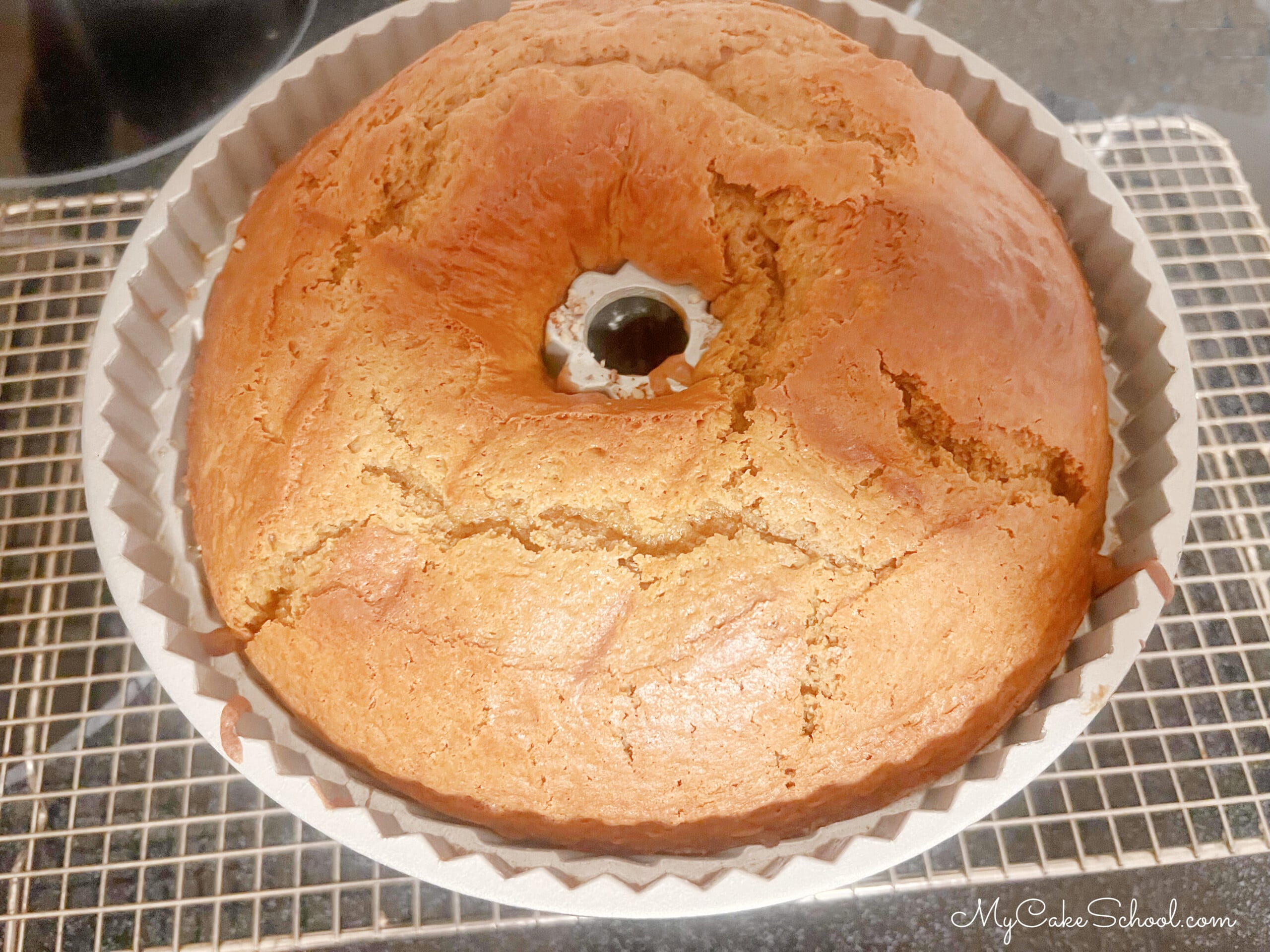 Freshly baked Sweet Potato Bundt Cake, cooling on a wire rack.