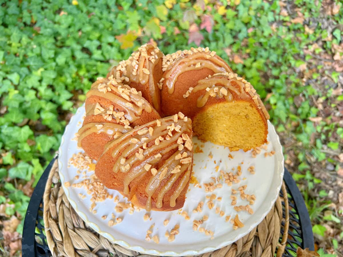 Pumpkin Spice Cake, sliced, on a pedestal