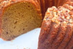 Sliced sweet potato bundt cake from cake mix on a pedestal.